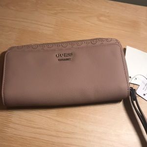 GUESS mauve wallet or handbag